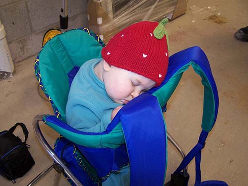 baby sleeping in her hiking carrier at home while testing gear