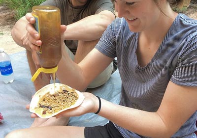 backpacking breakfast of tortilla with cereal and honey