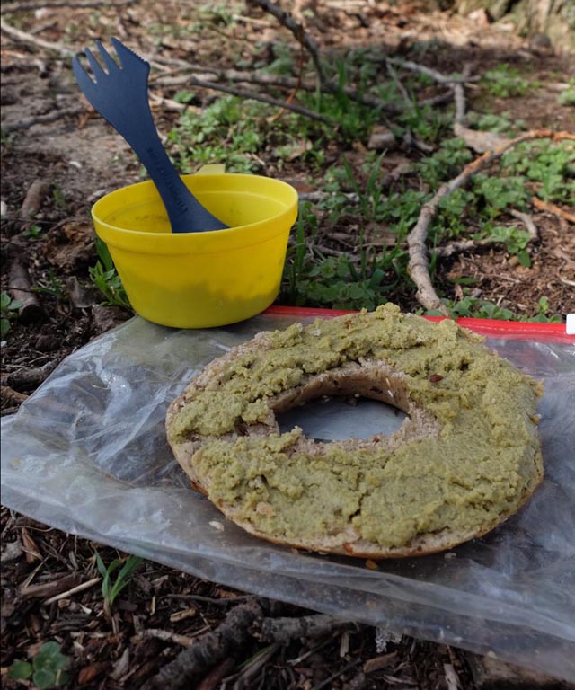 vegan pea dip on bagel for backpacking lunch