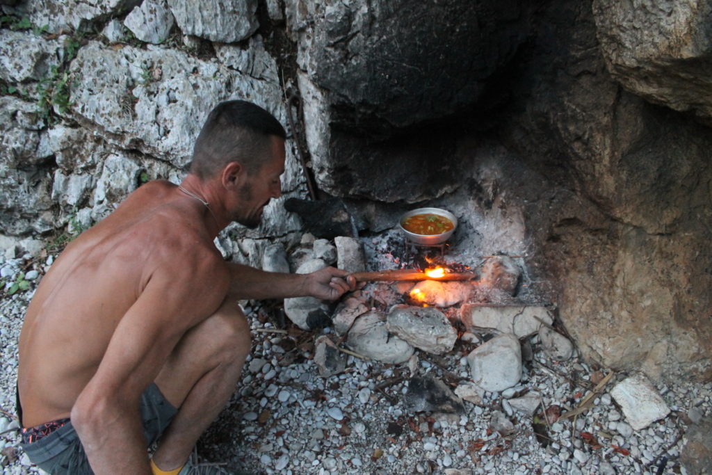 Cooking dinner over the hot coals