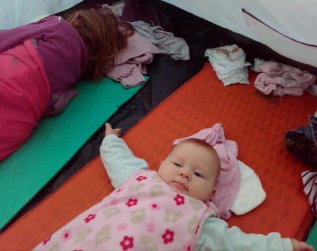 baby in tent on sleeping pad