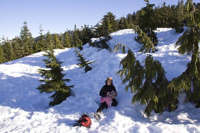 breastfeeding on winter hike in snow