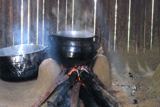 campfire cooking propped on rocks