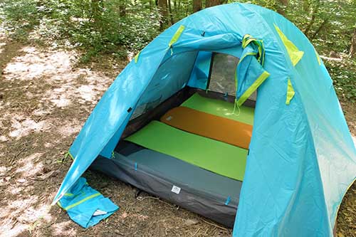 tent floor covered with four sleeping pads