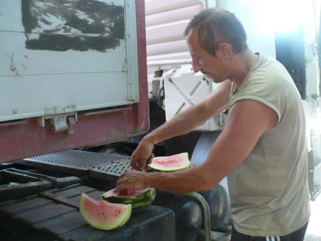 I hitchhiked a ride from this nice guy in Ukraine with a truck full of watermelon. We stopped to eat one on the way.