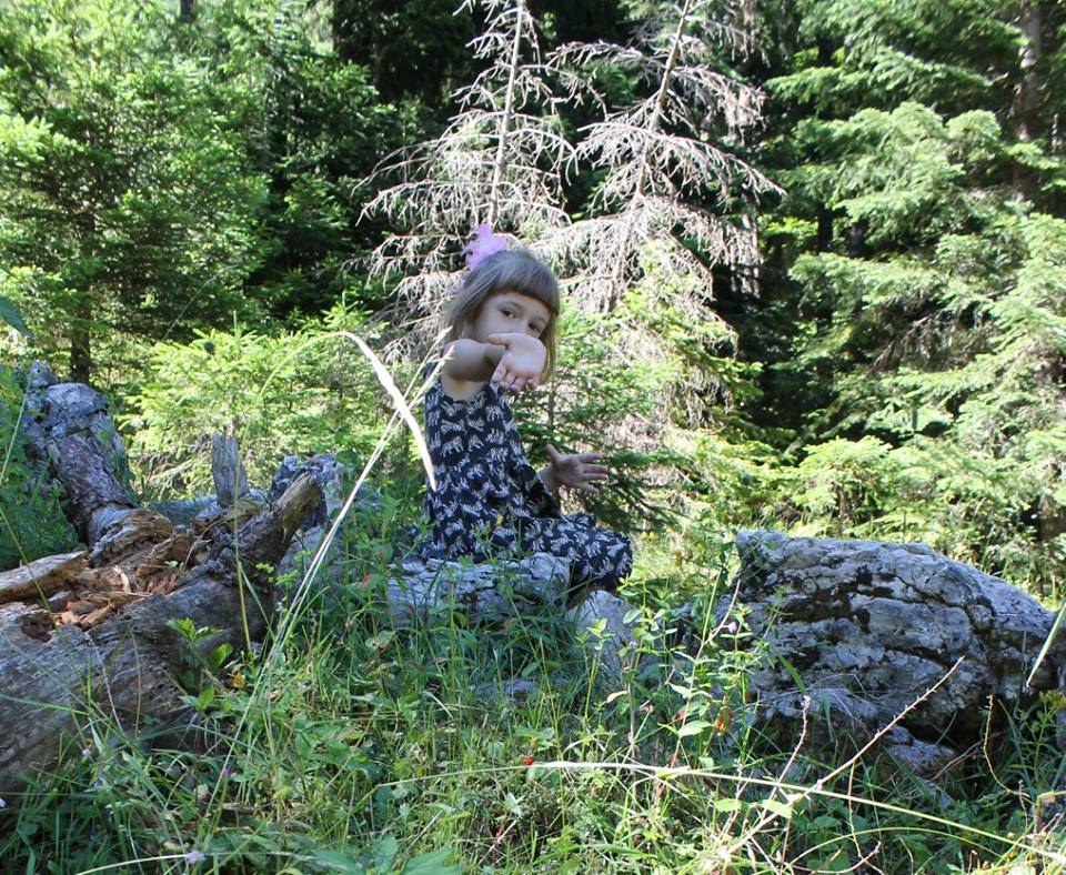 my daughter hiking off trail to get berries