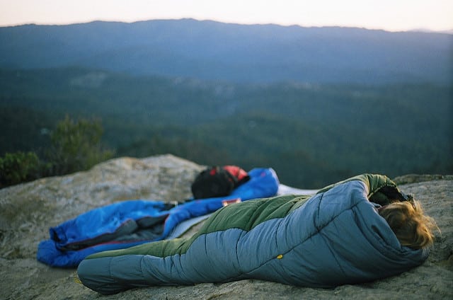 It may be a beautiful place to sleep, but that rock is going to suck the body heat from them! I'd layer some leaves underneath.