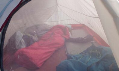 kid rolling off sleeping pad camping