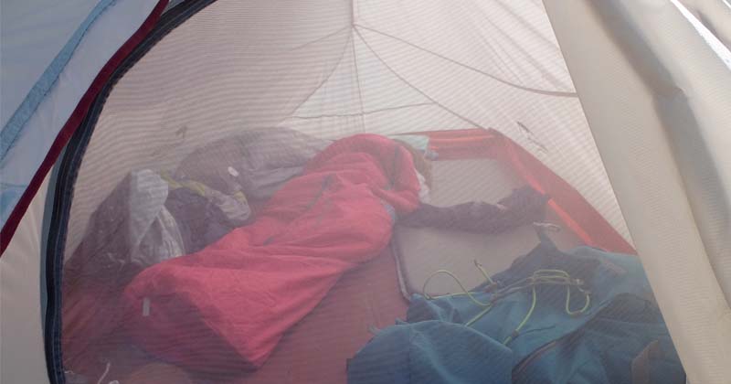 kid rolling off sleeping pad camping