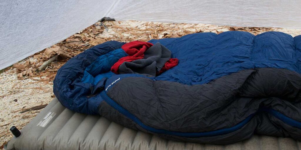 sleep in two sleeping bags to make one warmer bag